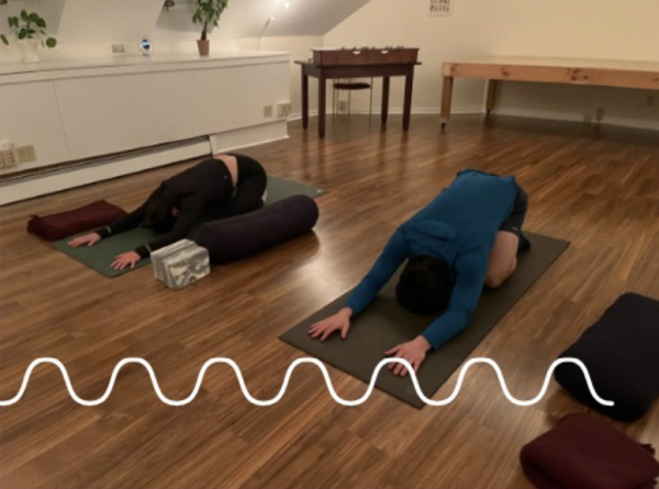 Two people doing yoga